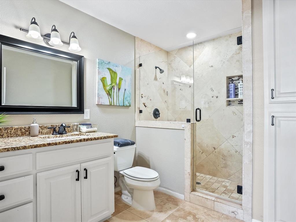 516 South Alabama Street Celina, TX 75009 - Photo 18 of 31 a bathroom with a toilet sink and shower