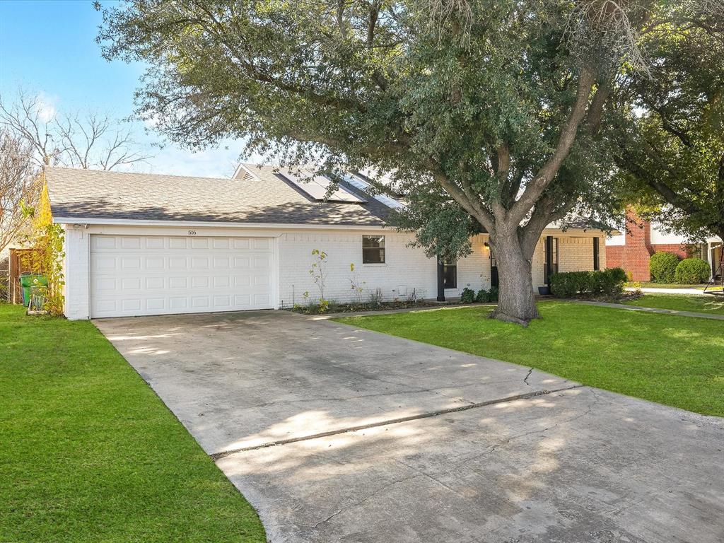 516 South Alabama Street Celina, TX 75009 - Photo 2 of 31 a view of a house with a yard and garage