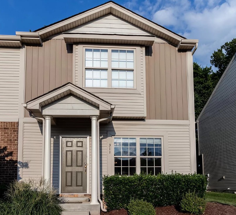 735 Tulip Grove Road, Unit 311 Hermitage, TN 37076 - Photo 1 of 35 a front view of a house with a yard