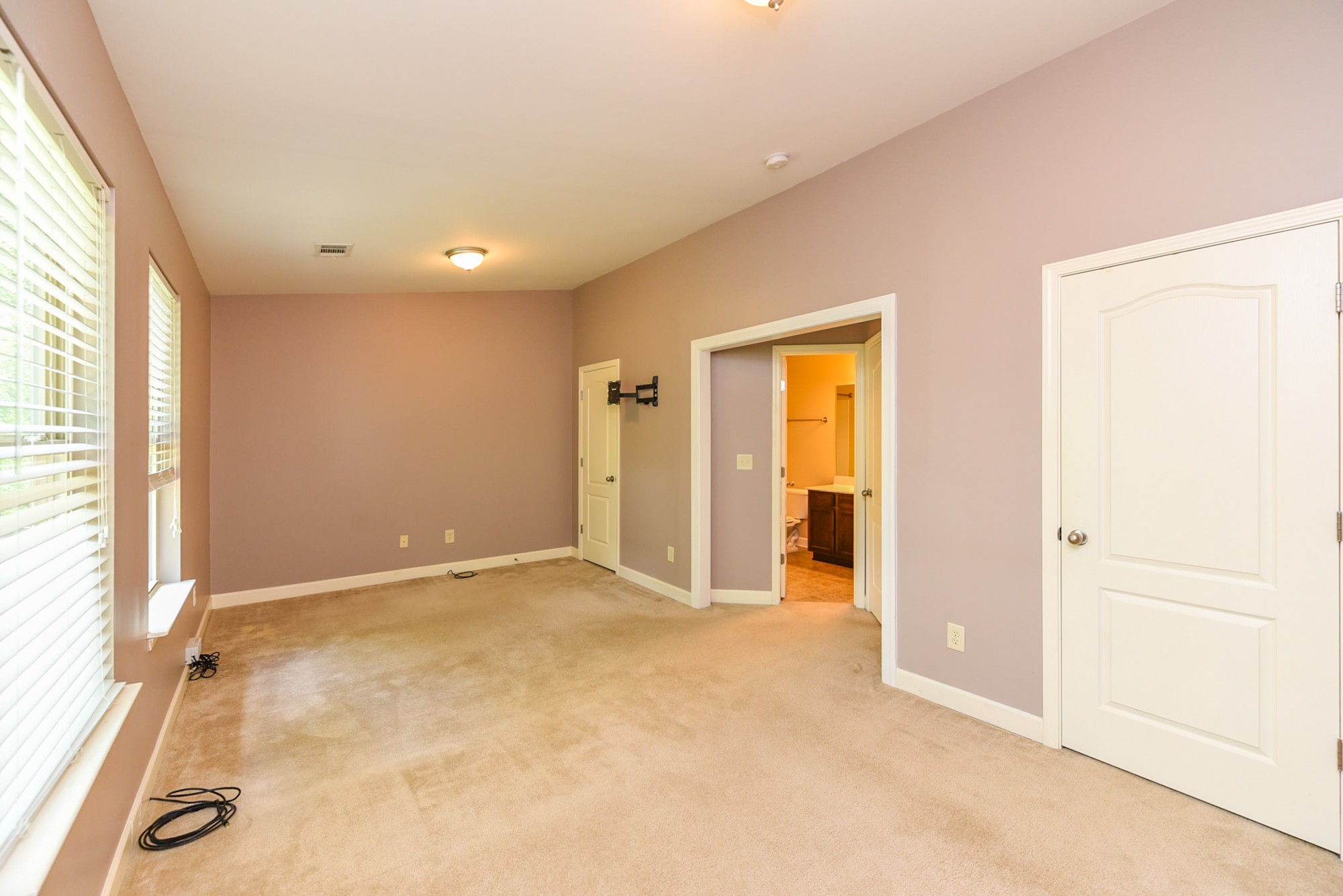 735 Tulip Grove Road, Unit 311 Hermitage, TN 37076 - Photo 19 of 35 an empty room with windows and closet