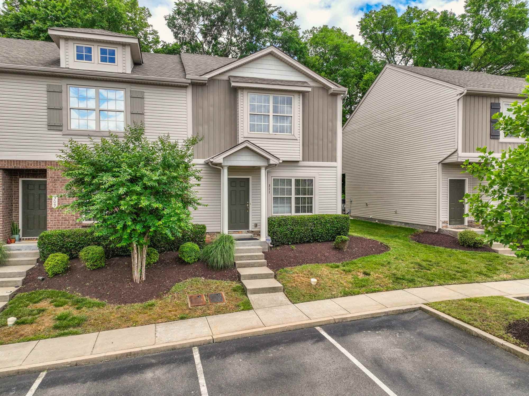 735 Tulip Grove Road, Unit 311 Hermitage, TN 37076 - Photo 2 of 35 front view of a house with a yard