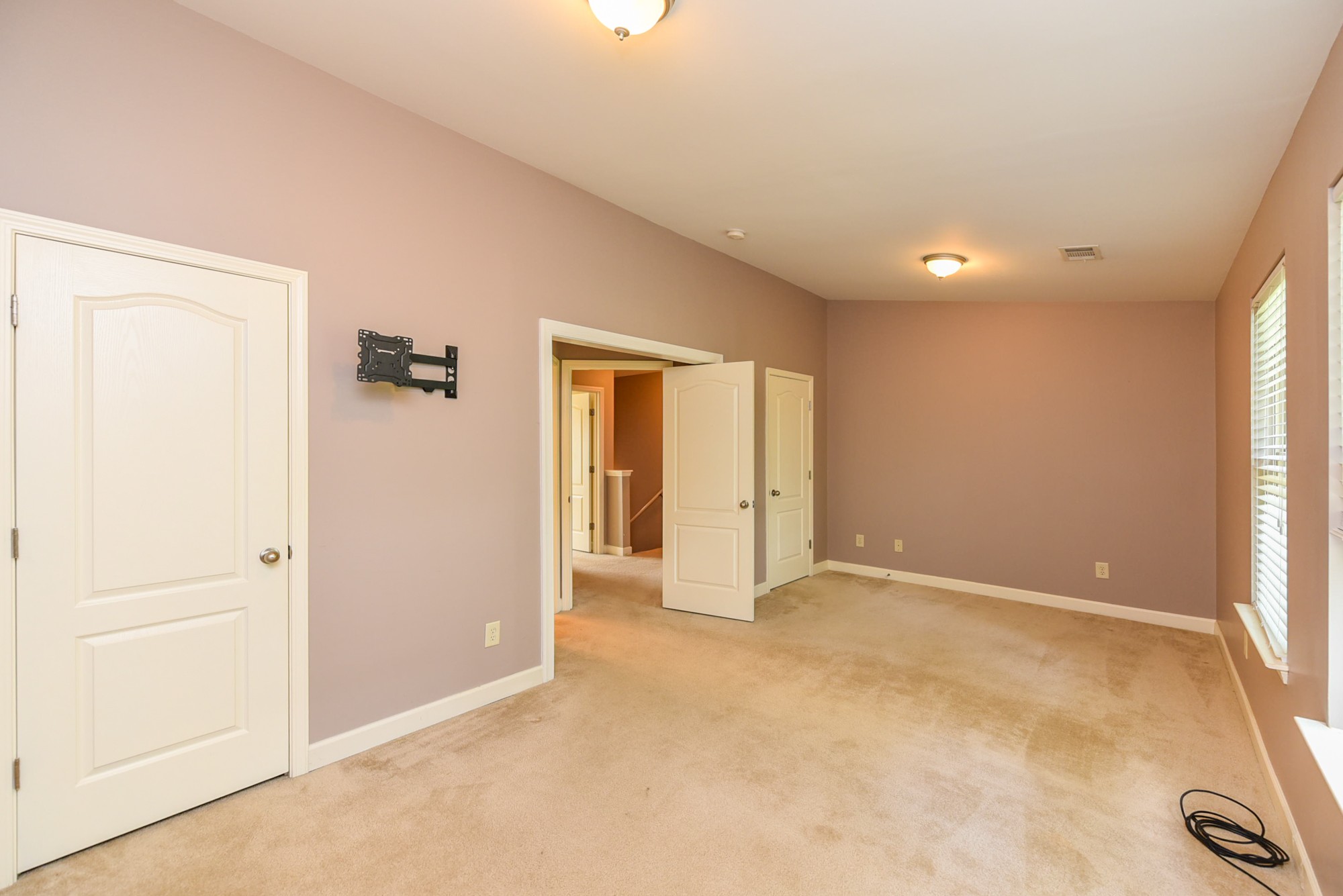 735 Tulip Grove Road, Unit 311 Hermitage, TN 37076 - Photo 21 of 35 an empty room with closet and a window