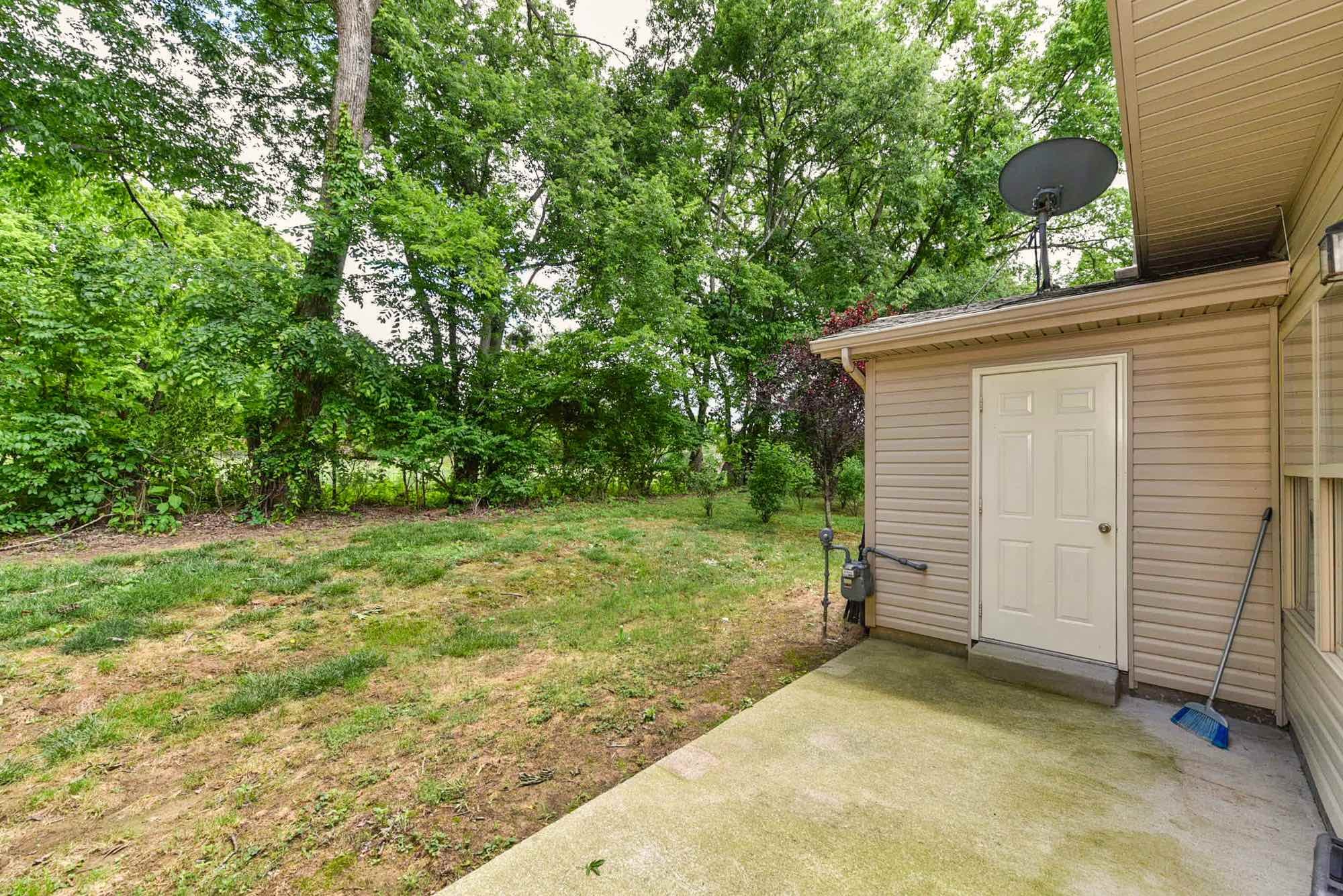 735 Tulip Grove Road, Unit 311 Hermitage, TN 37076 - Photo 33 of 35 a view of a backyard with a tree