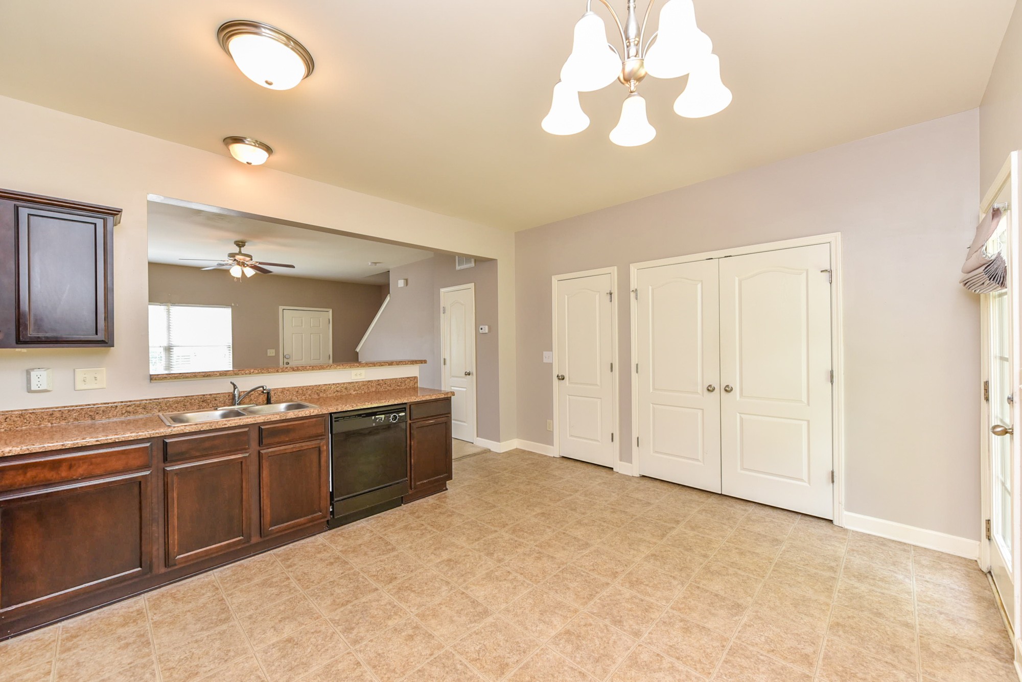 735 Tulip Grove Road, Unit 311 Hermitage, TN 37076 - Photo 10 of 35 a large kitchen with kitchen island a sink stainless steel appliances and cabinets