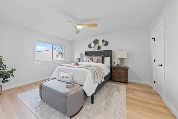 a bedroom with a bed and a window