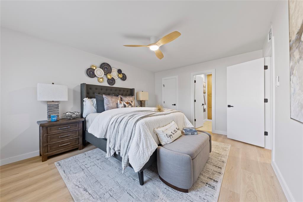 3121 Wayfarer Road Bedford, TX 76021 - Photo 22 of 32 Bedroom with light wood-type flooring and a ceiling fan