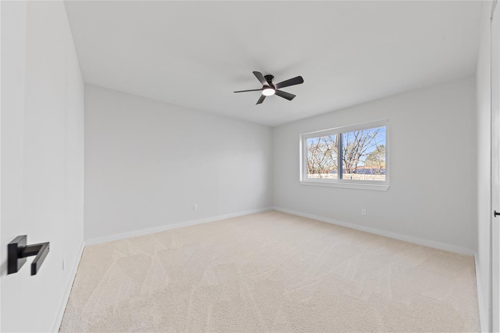 3121 Wayfarer Road Bedford, TX 76021 - Photo 27 of 32 Bedroom featuring light carpet and ceiling fan