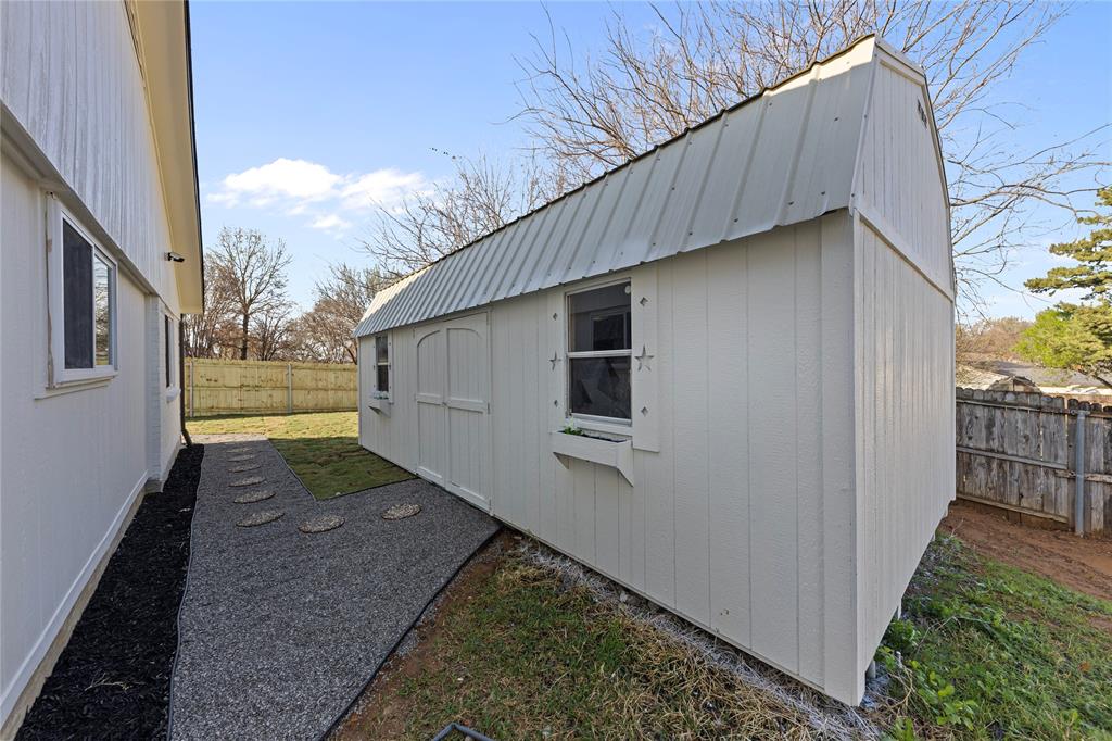 3121 Wayfarer Road Bedford, TX 76021 - Photo 31 of 32 View of shed with a fenced backyard