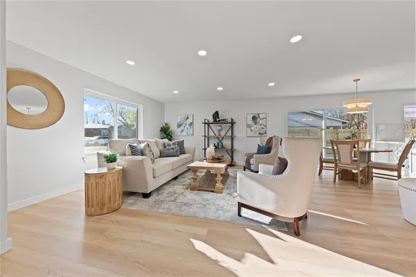 a living room with furniture and a table