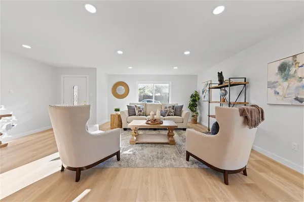 a living room with furniture and a table