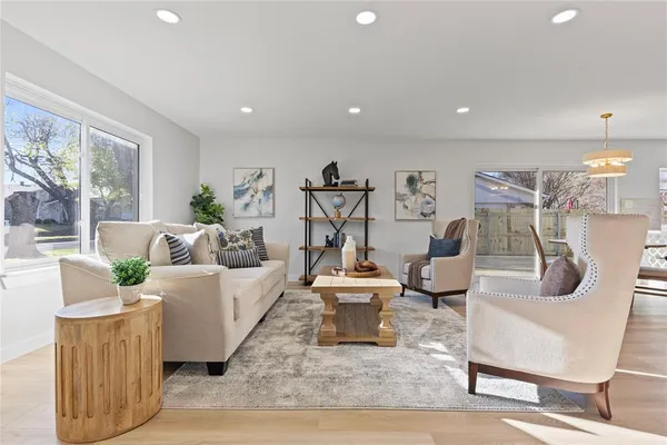 a living room with furniture and a table