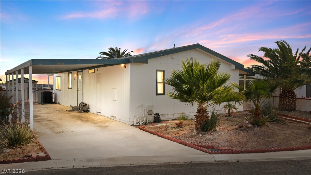 1655 Granada Street Laughlin, NV 89029 - Photo 1 of 76 View of front of property with crawl space, an attached carport, and concrete driveway
