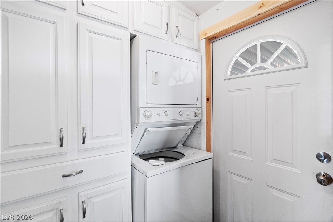1655 Granada Street Laughlin, NV 89029 - Photo 20 of 76 Laundry area with stacked washer / drying machine and cabinet space