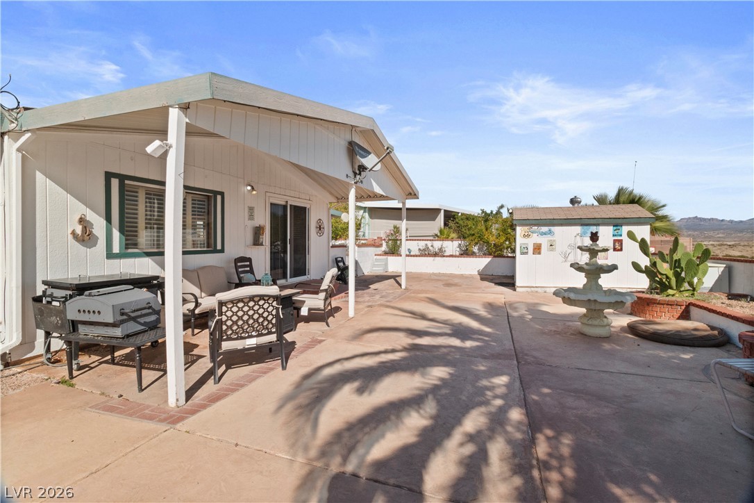1655 Granada Street Laughlin, NV 89029 - Photo 35 of 76 View of patio / terrace featuring area for grilling, an outdoor living space, and an outdoor structure