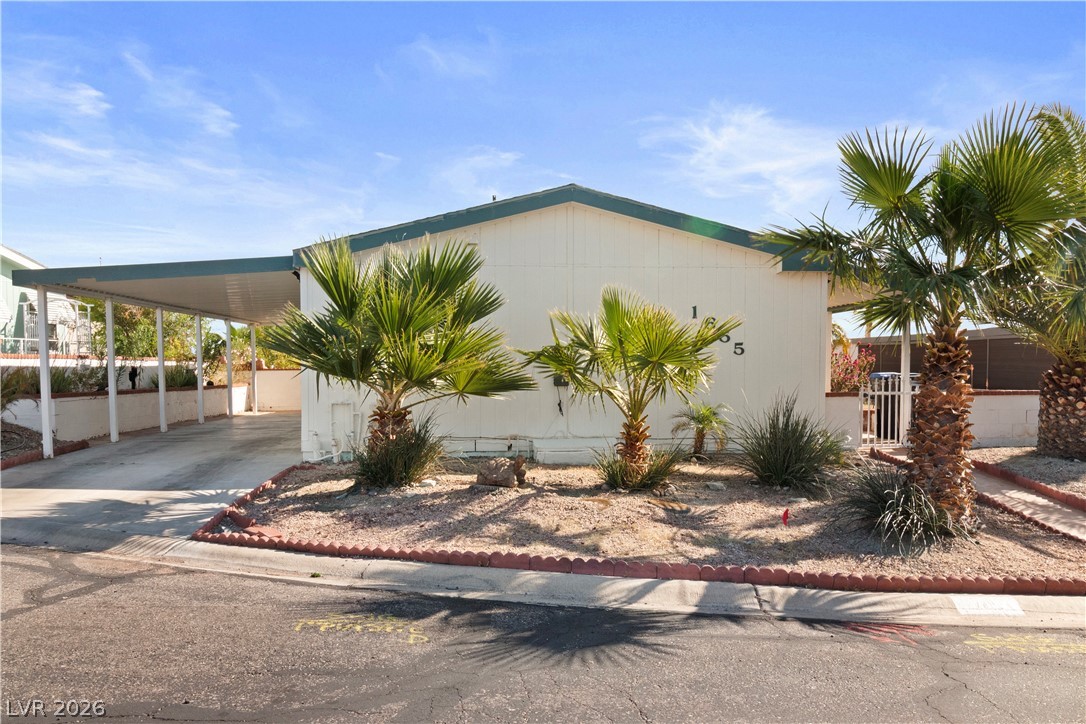 1655 Granada Street Laughlin, NV 89029 - Photo 44 of 76 View of front of house with concrete driveway and an attached carport
