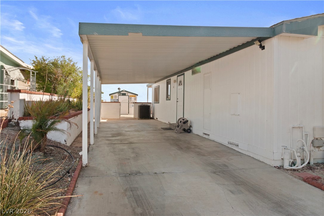 1655 Granada Street Laughlin, NV 89029 - Photo 46 of 76 View of patio / terrace featuring a carport and a gate