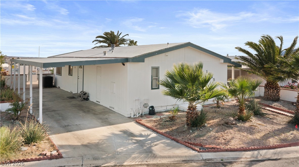 1655 Granada Street Laughlin, NV 89029 - Photo 50 of 76 View of front facade with crawl space, an attached carport, and driveway