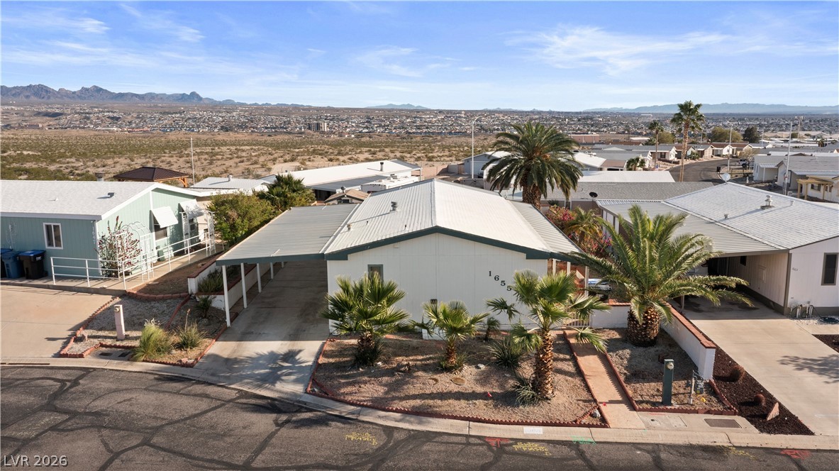 1655 Granada Street Laughlin, NV 89029 - Photo 54 of 76 Aerial view of residential area with a mountain backdrop