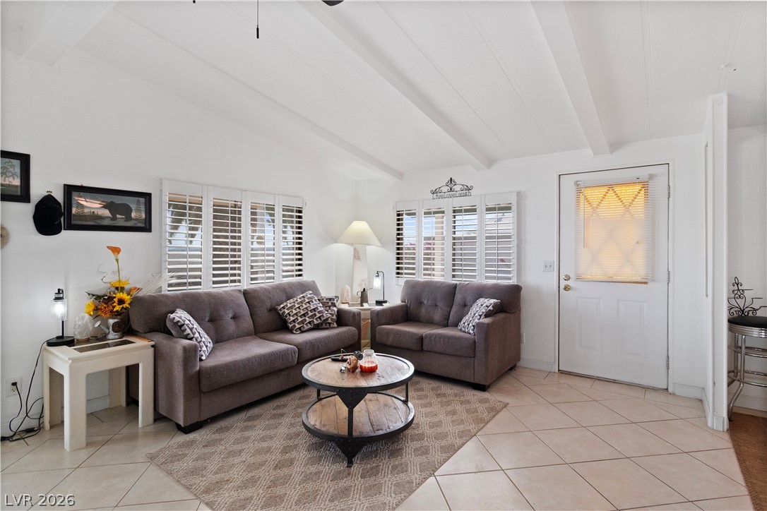 1655 Granada Street Laughlin, NV 89029 - Photo 6 of 76 Living area featuring light tile patterned flooring and lofted ceiling with beams