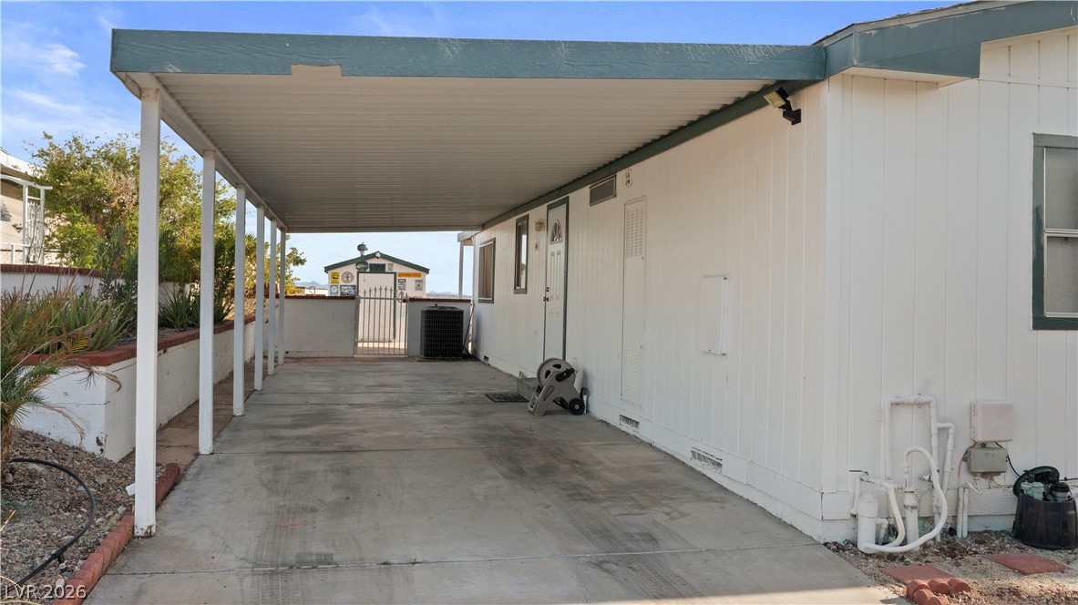 1655 Granada Street Laughlin, NV 89029 - Photo 61 of 76 View of patio featuring a carport and a gate to backyard
