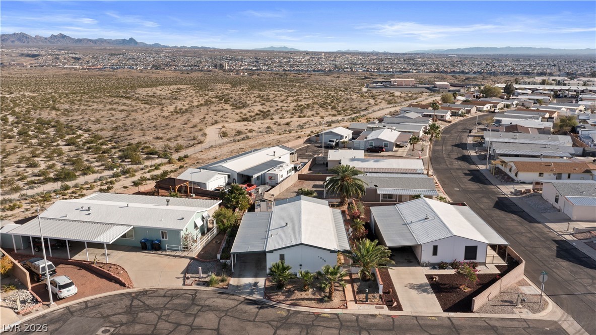 1655 Granada Street Laughlin, NV 89029 - Photo 64 of 76 Aerial perspective of suburban area with a mountain backdrop