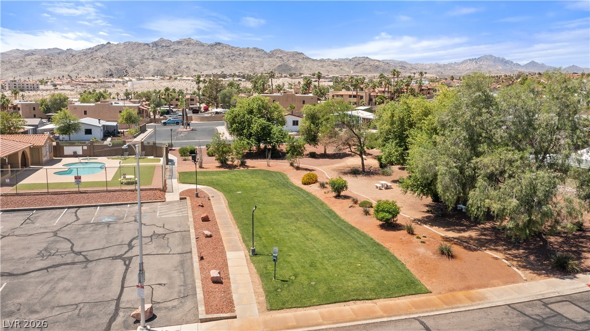 1655 Granada Street Laughlin, NV 89029 - Photo 69 of 76 Aerial View of community park area, community pool, and available RV / Boat parking with a mountain view