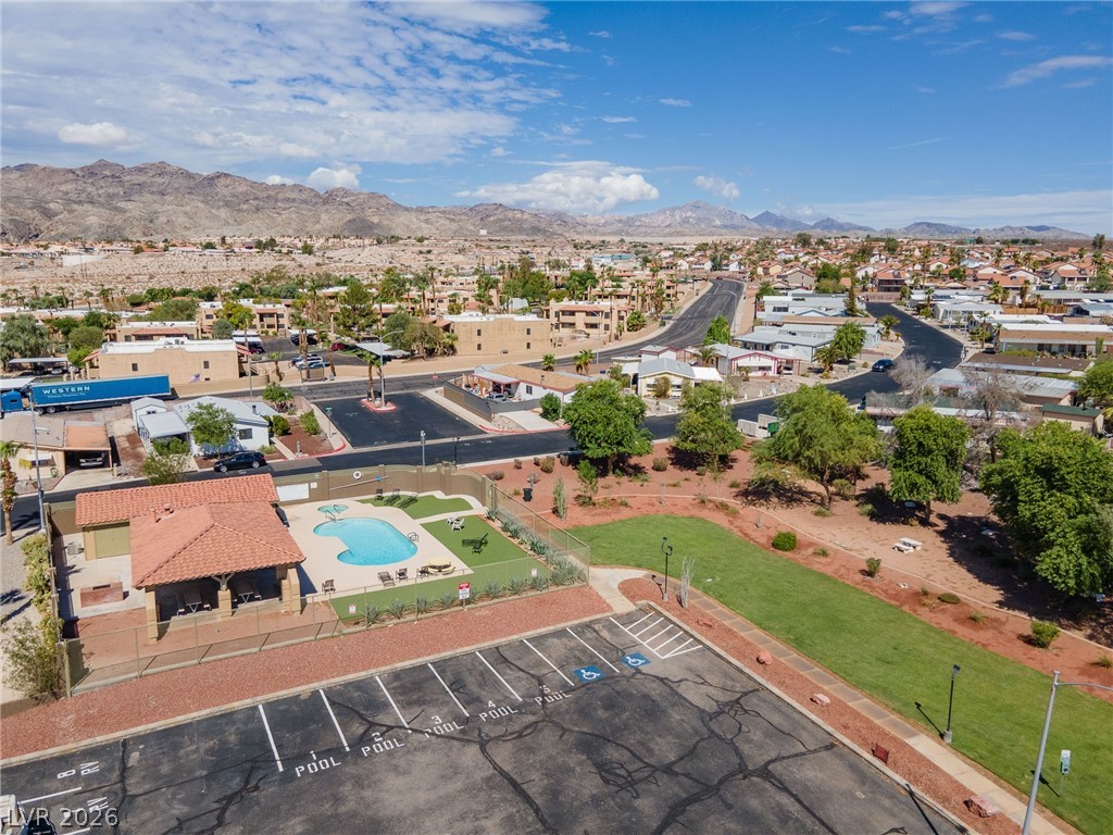 1655 Granada Street Laughlin, NV 89029 - Photo 70 of 76 Aerial View of community park area, community pool, and available RV / Boat parking with a mountain view