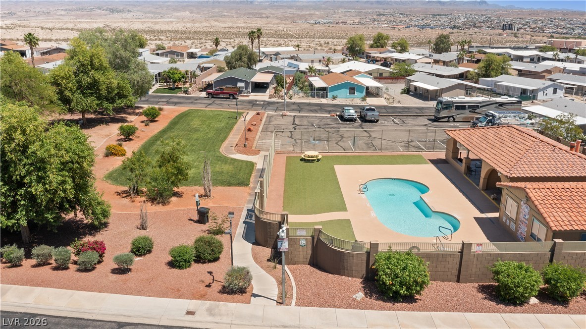 1655 Granada Street Laughlin, NV 89029 - Photo 75 of 76 Aerial View of community park area, community pool, and available RV / Boat parking with a mountain view
