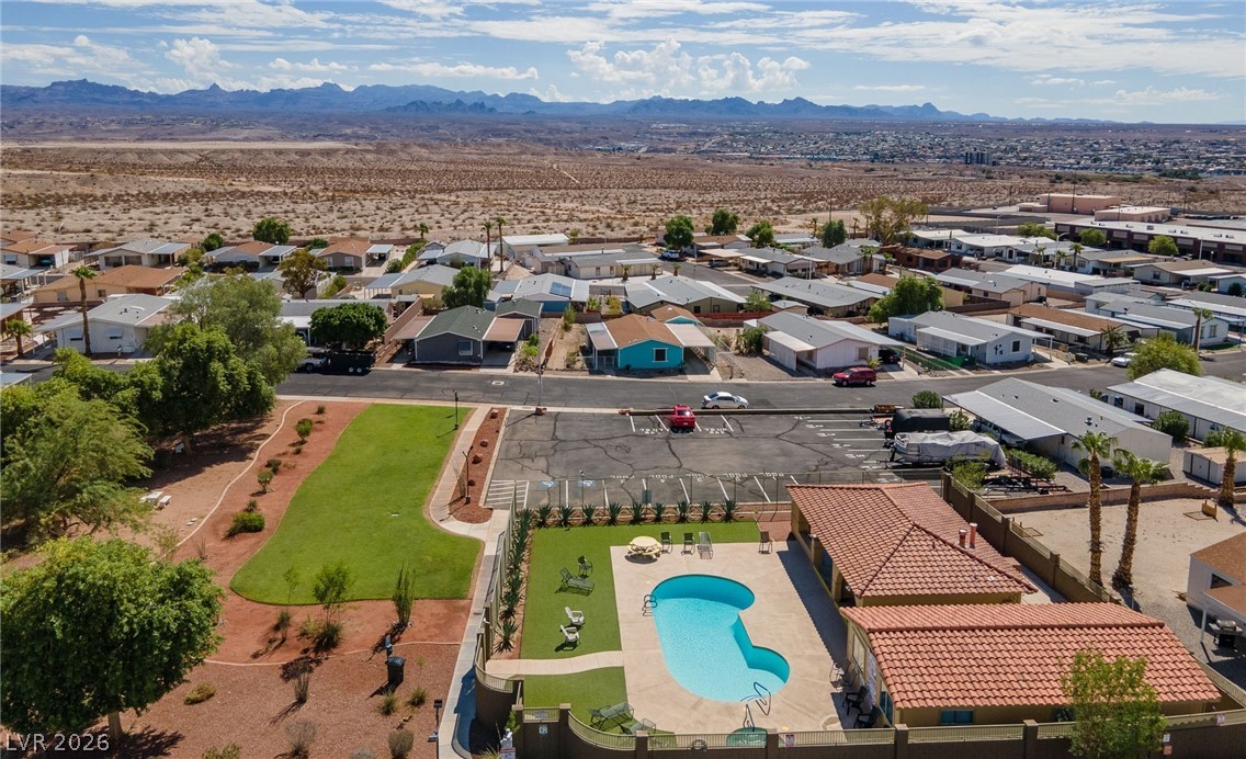 1655 Granada Street Laughlin, NV 89029 - Photo 76 of 76 Aerial View of community park area, community pool, and available RV / Boat parking with a mountain view