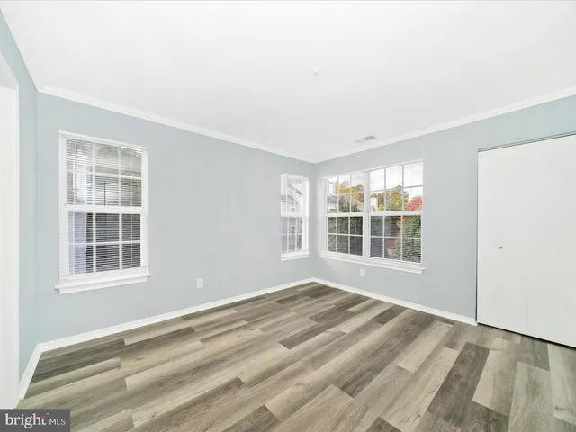 a view of empty room with windows