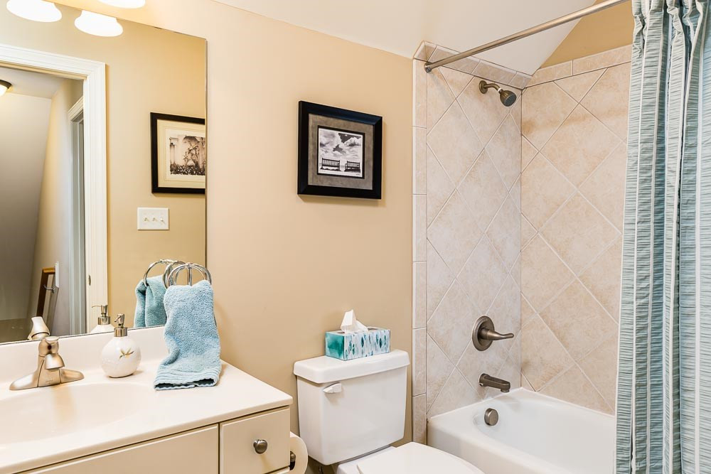 8415 Wheatstone Lane Raleigh, NC 27613 - Photo 27 of 30 Yet another full bath with tile shower/tub combo! Will this floor be your teen's dream space? A guest suite? SO many options! 3rd Floor Bath