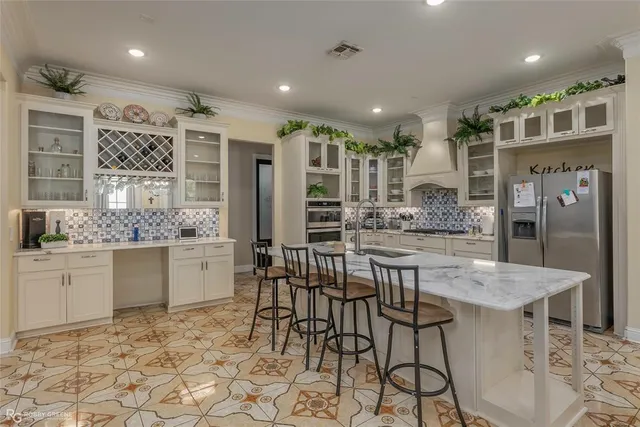 a kitchen with a table and chairs in it