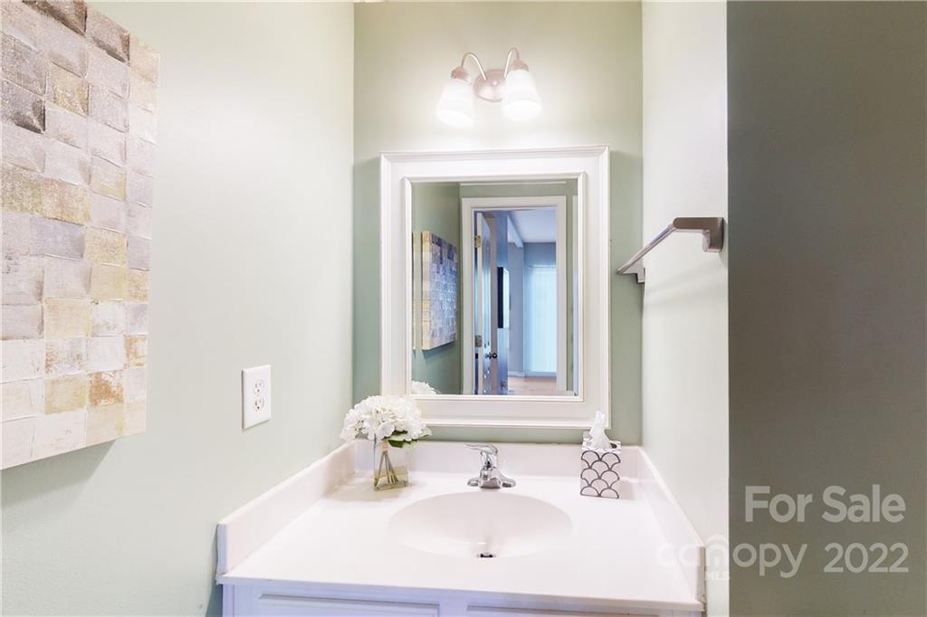 9136 Redmond Trace Road Charlotte, NC 28277 - Photo 13 of 37 a bathroom with a sink and a mirror