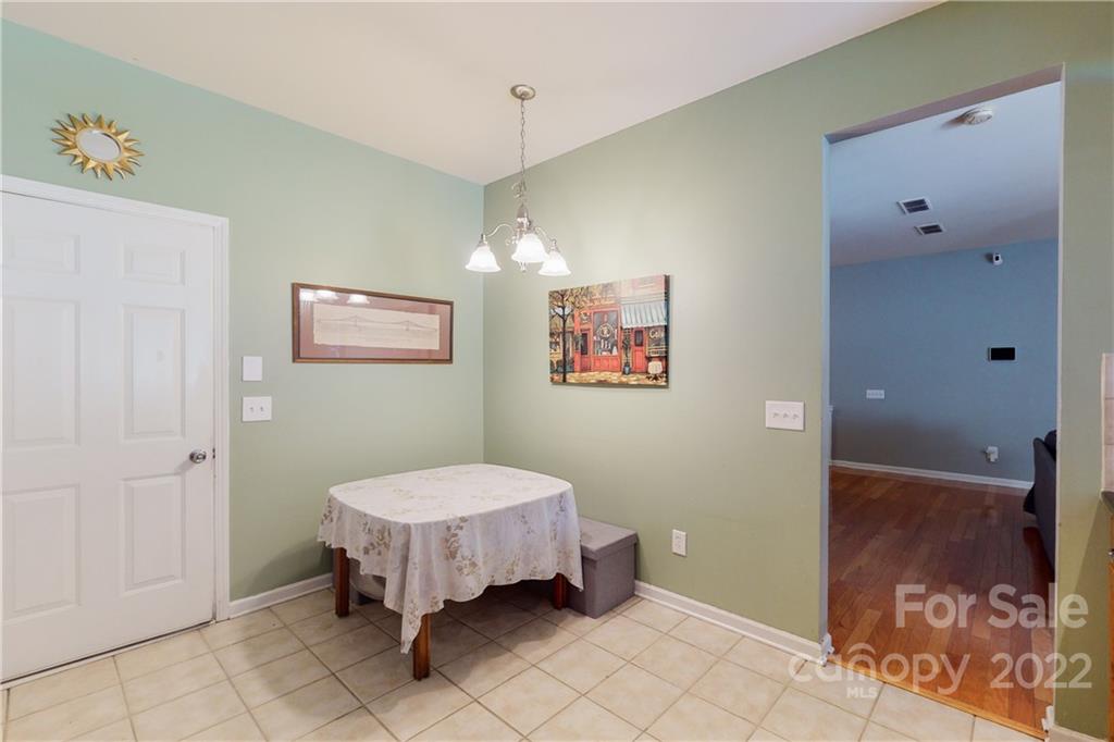 9136 Redmond Trace Road Charlotte, NC 28277 - Photo 18 of 37 a spacious bedroom with a bed and a table