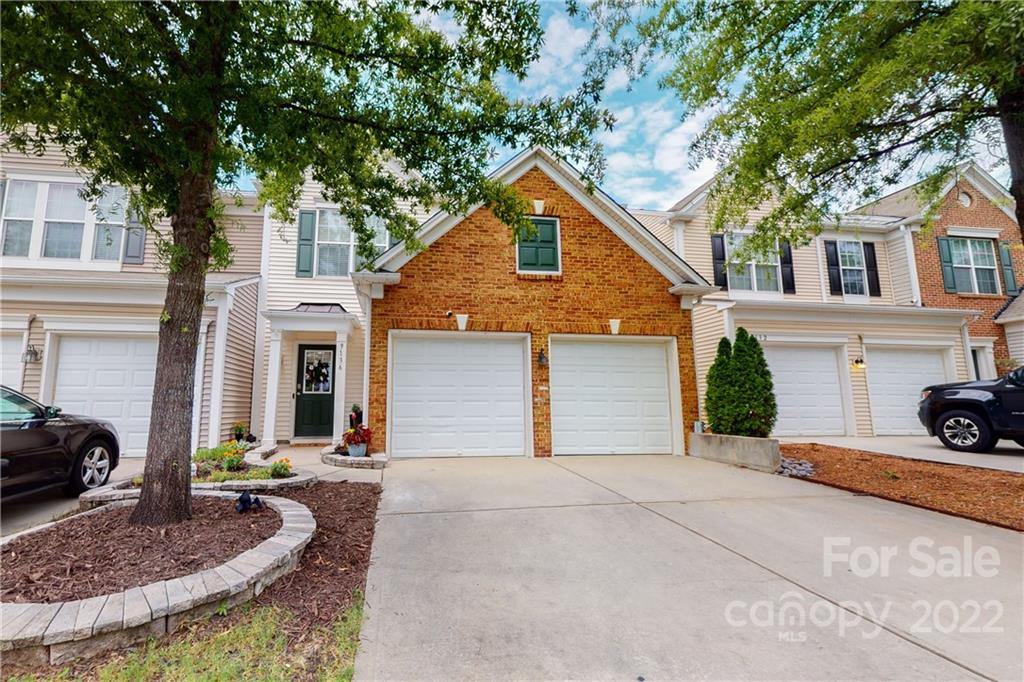 9136 Redmond Trace Road Charlotte, NC 28277 - Photo 2 of 37 a front view of a house with porch and garage