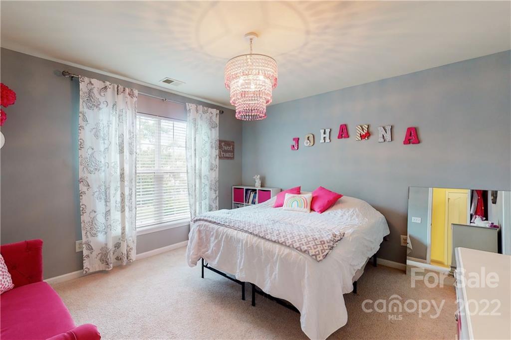 9136 Redmond Trace Road Charlotte, NC 28277 - Photo 25 of 37 a bedroom with bed and a window
