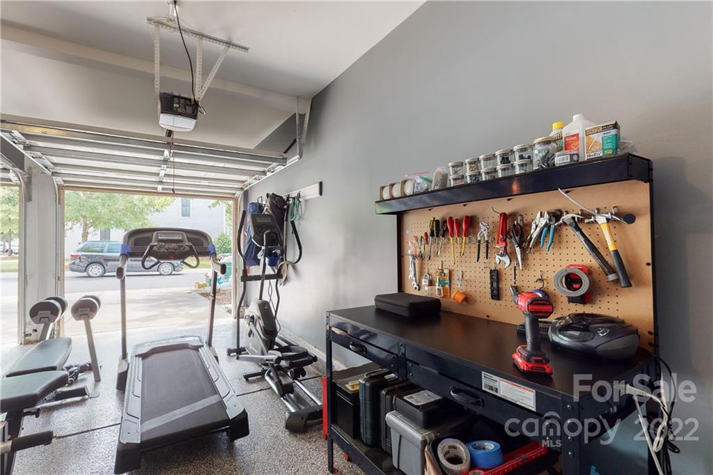 9136 Redmond Trace Road Charlotte, NC 28277 - Photo 32 of 37 a room with gym equipment and mirror
