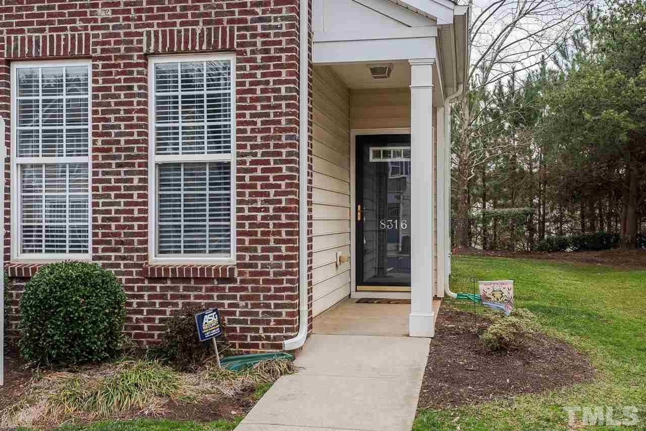 8316 City Loft Court Raleigh, NC 27613 - Photo 22 of 25 a view of a pathway besides a house