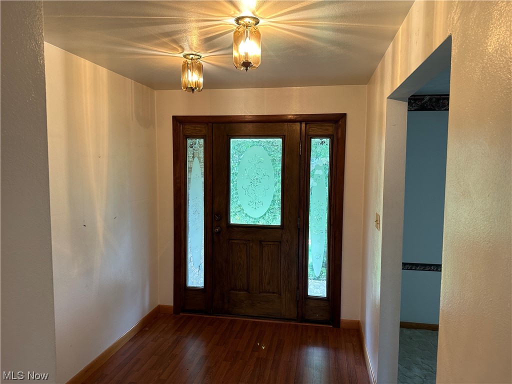62273 Tacoma Road Barnesville, OH 43713 - Photo 19 of 34 Foyer entrance featuring dark hardwood flooring