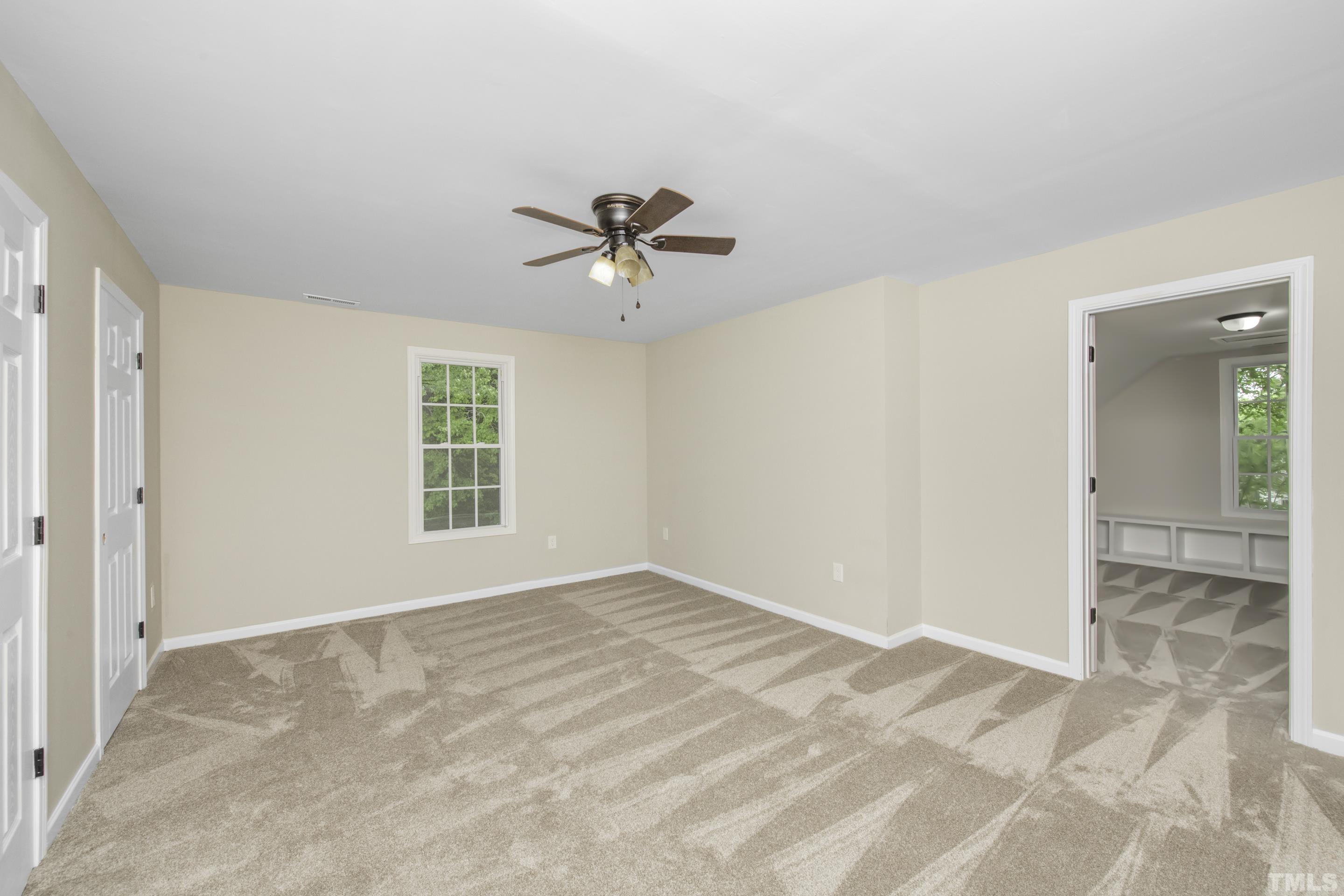 212 Junction Road Durham, NC 27703 - Photo 41 of 50 a view of a room with a ceiling fan and a window