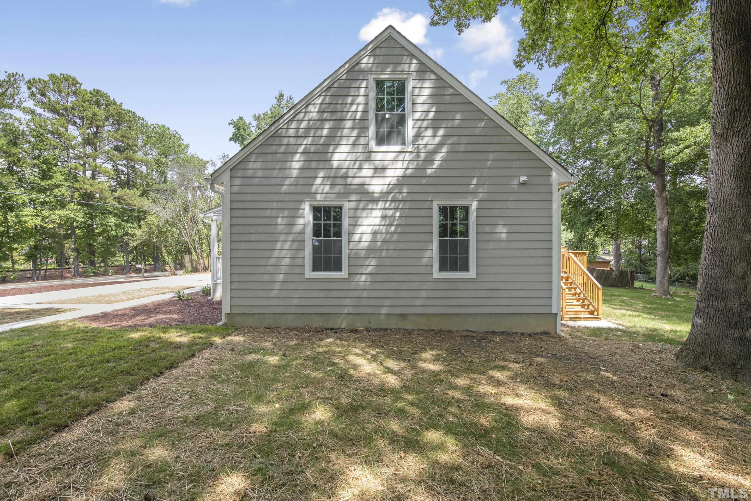212 Junction Road Durham, NC 27703 - Photo 49 of 50 a view of a house with backyard and garden