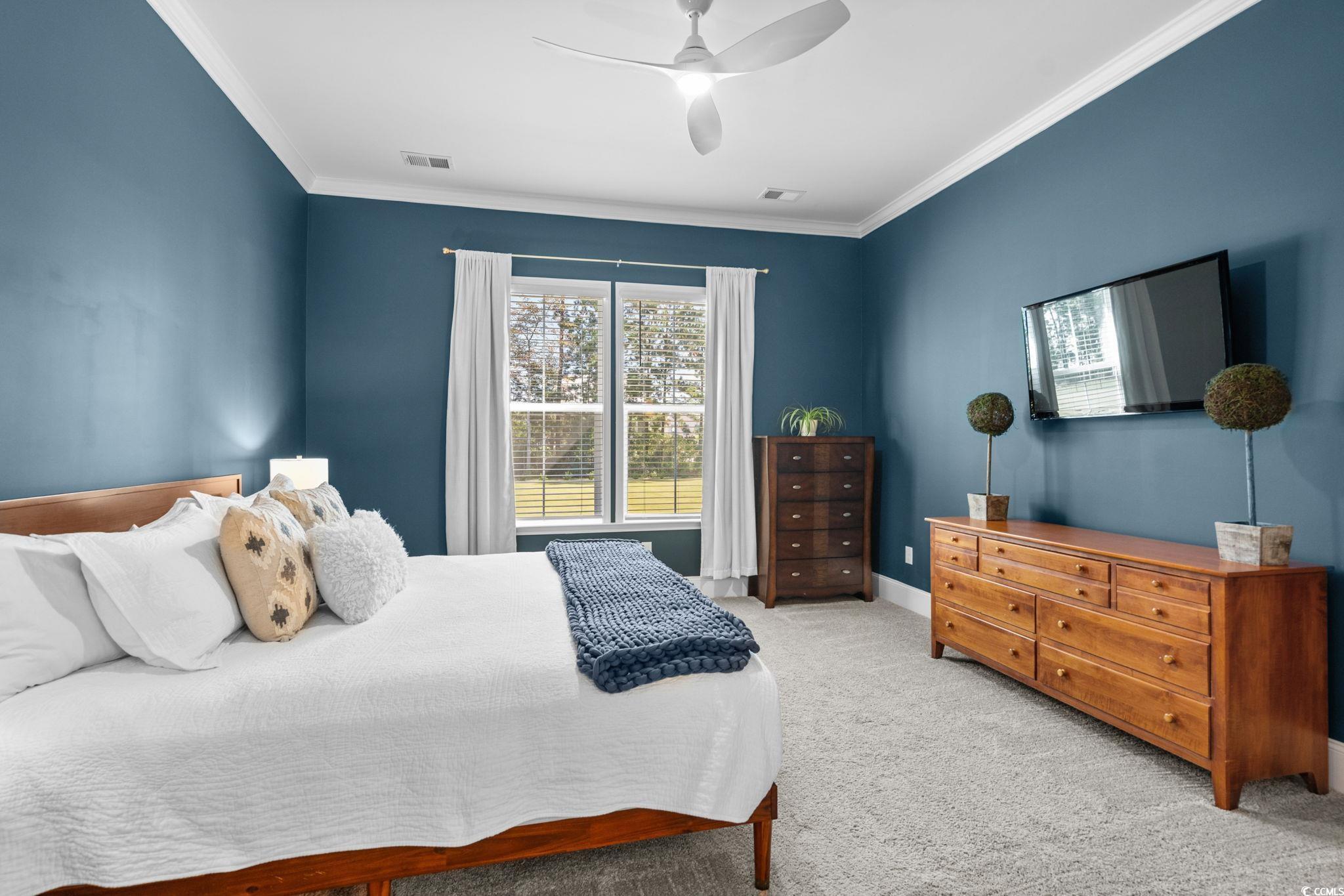 191 Blackwater Drive Murrells Inlet, SC 29576 - Photo 16 of 40 Carpeted bedroom with crown molding and ceiling fan