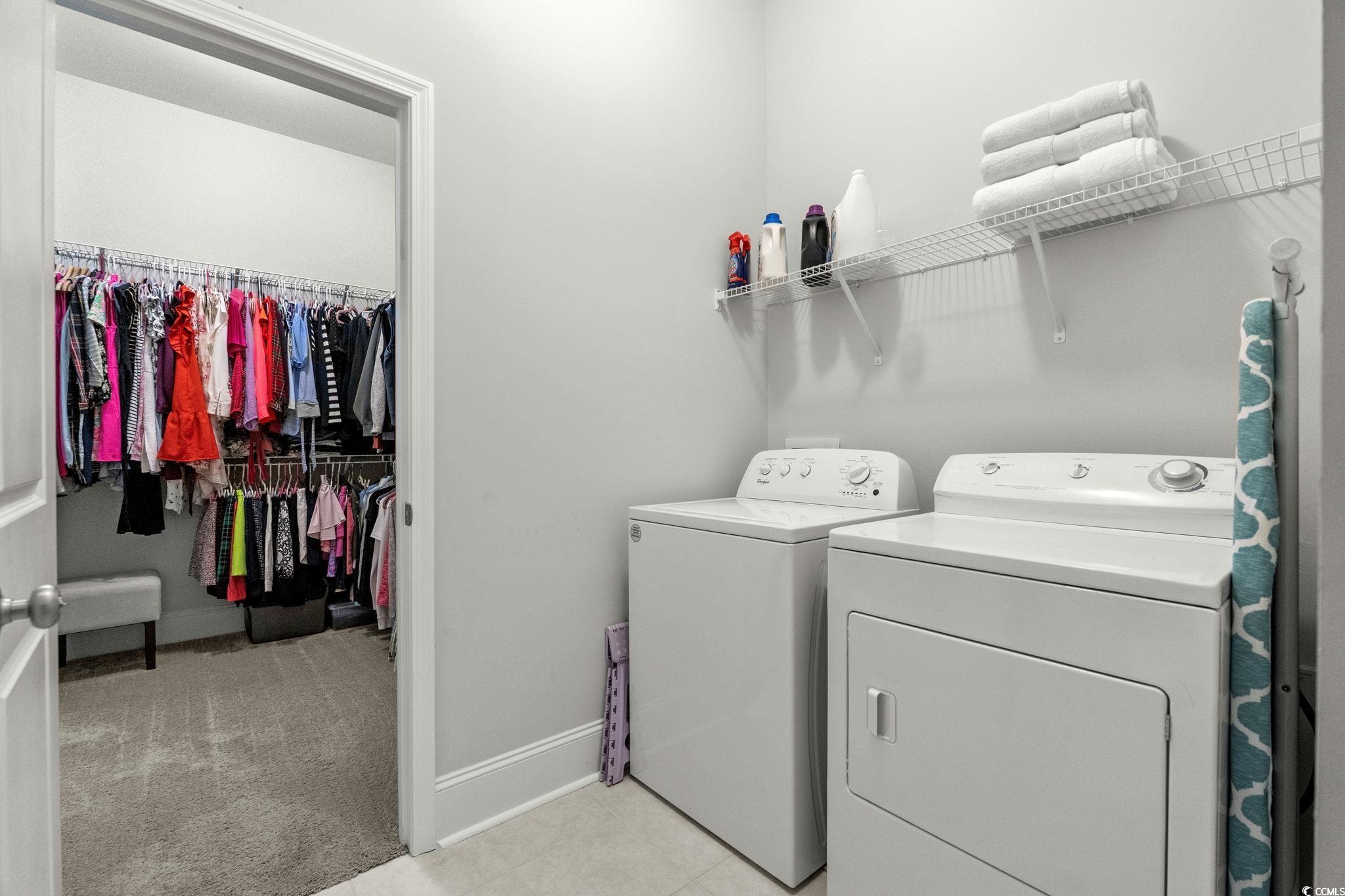 191 Blackwater Drive Murrells Inlet, SC 29576 - Photo 22 of 40 Laundry room with light colored carpet and washer and dryer