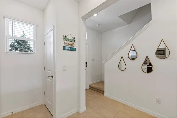 a view of an entryway with wooden floor