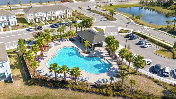 an aerial view of residential houses with outdoor space