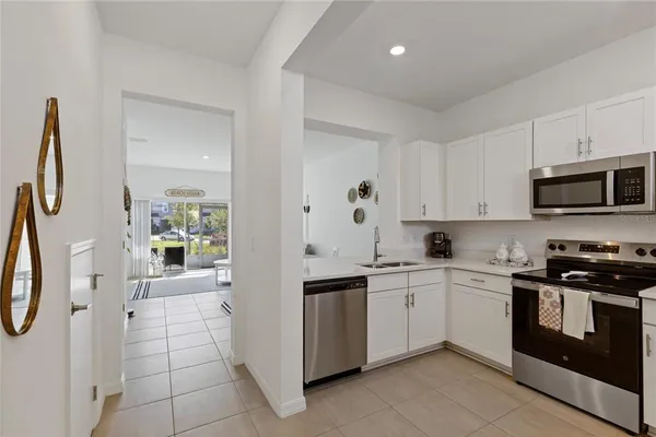 a kitchen with stainless steel appliances granite countertop a stove and a sink