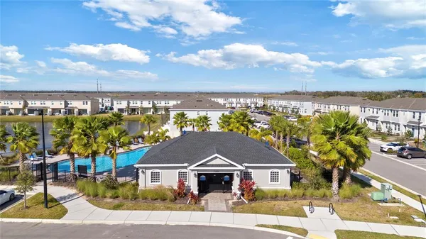 a view of house with a yard and ocean view