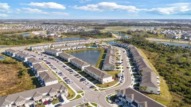 an aerial view of residential building and ocean