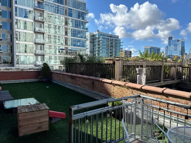 a view of a backyard with sitting area