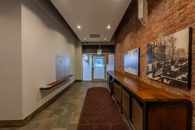 a kitchen with wooden cabinets and stainless steel appliances